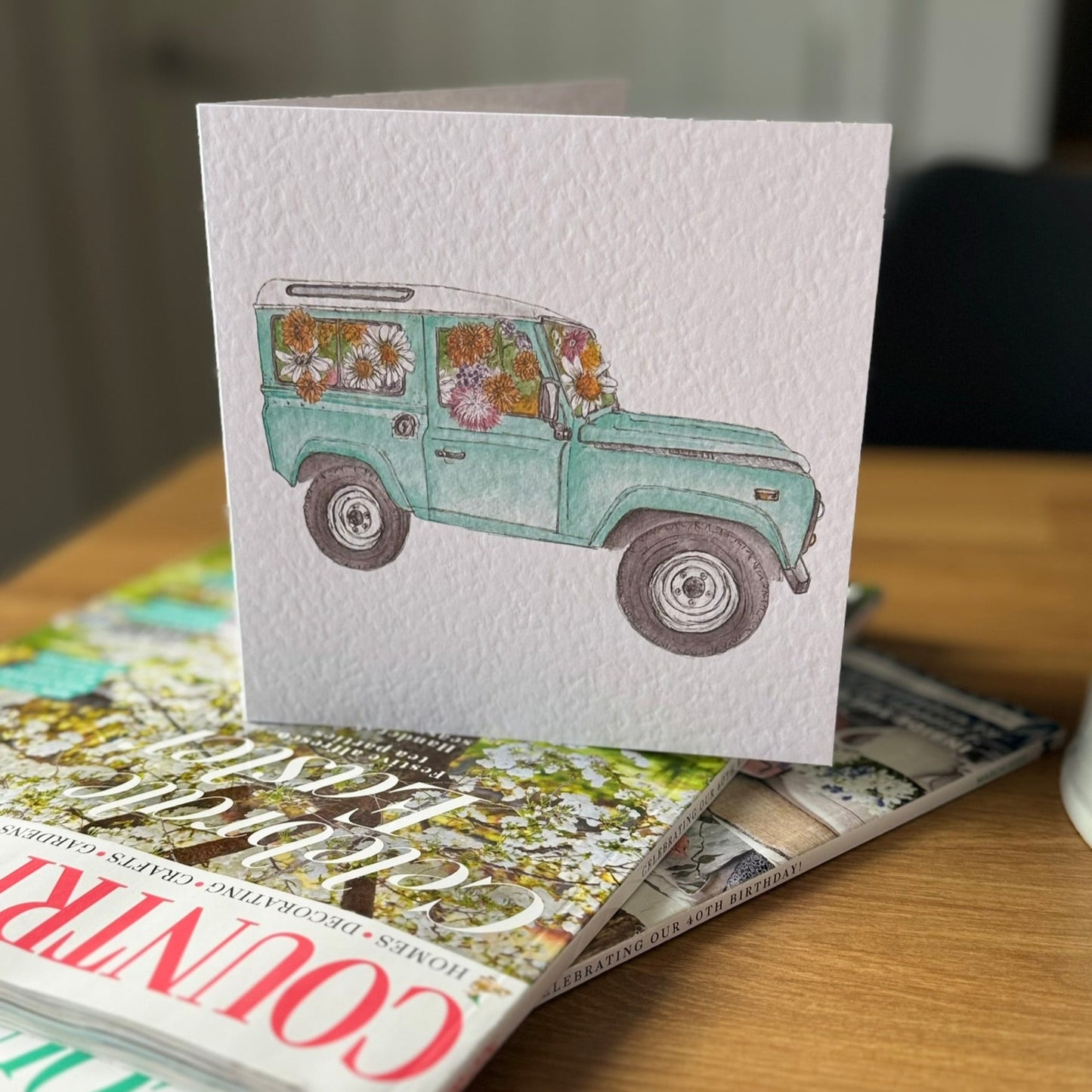 Greeting card with illustration of flower filled defender