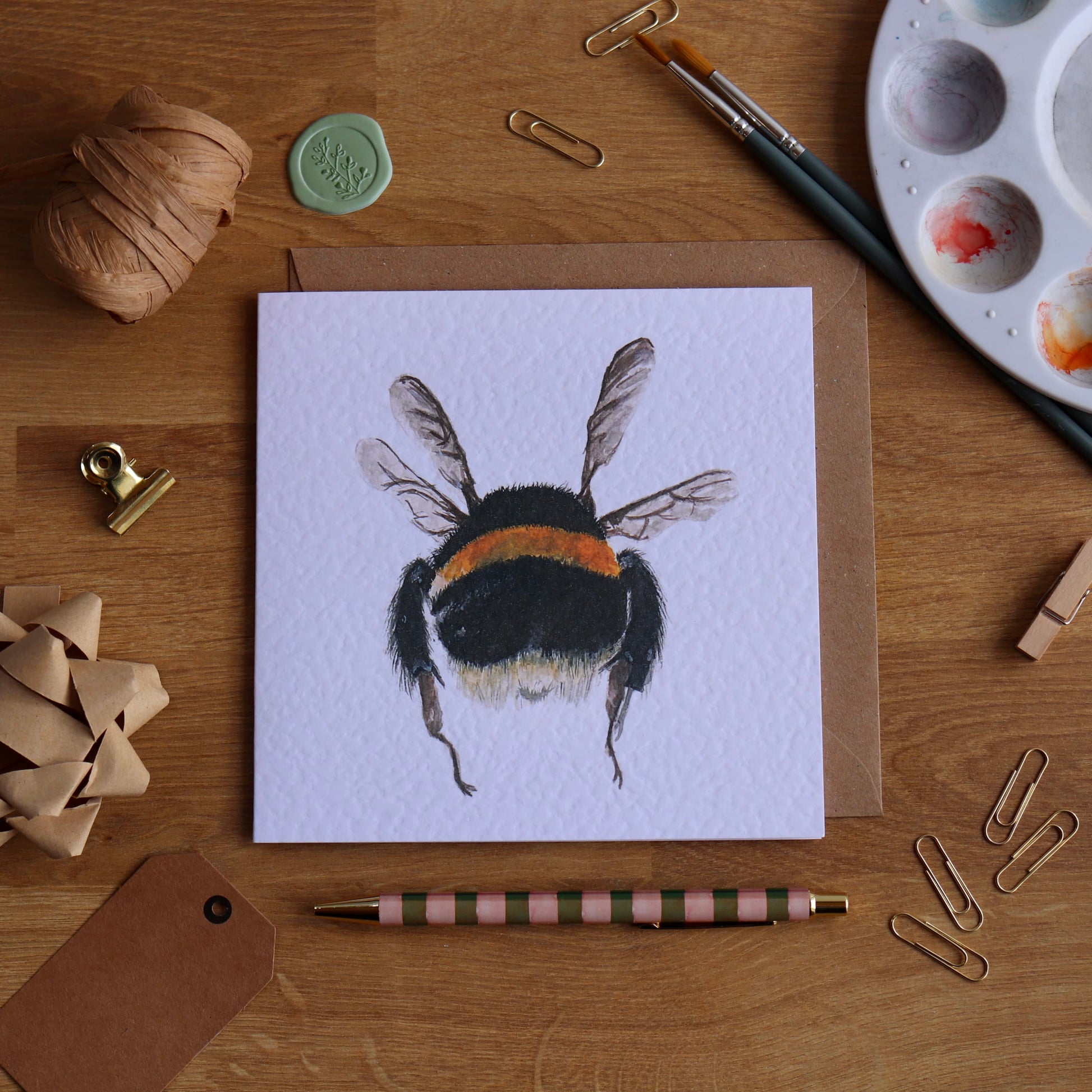 Greeting card with illustration of bumble bee in mid flight
