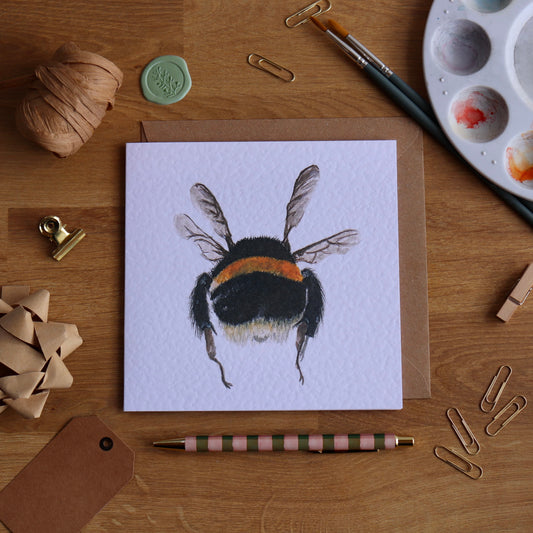 Greeting card with illustration of bumble bee in mid flight