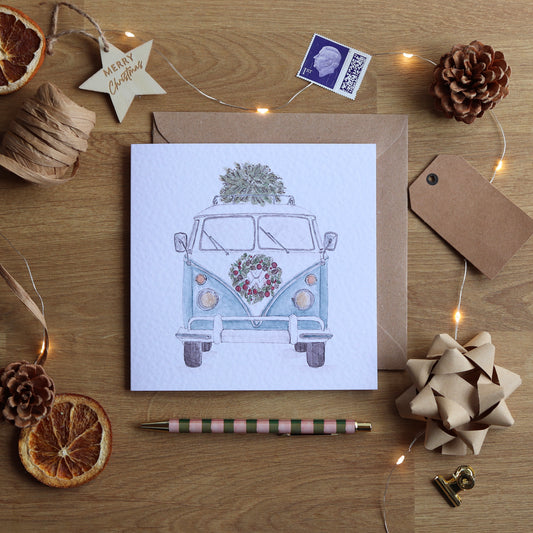 Christmas card with illustration of a festive camper van