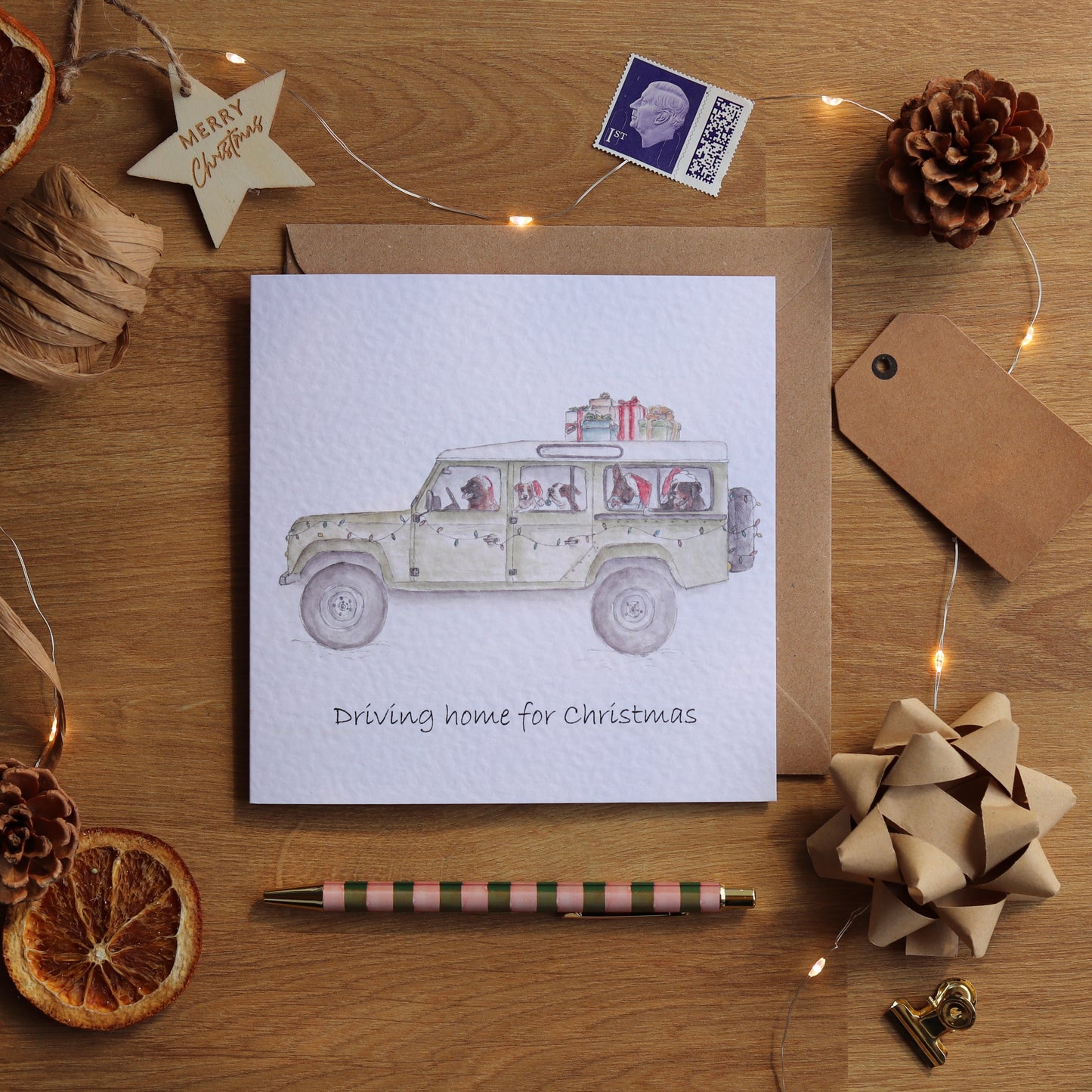Christmas card with illustration of defender full of festive dogs