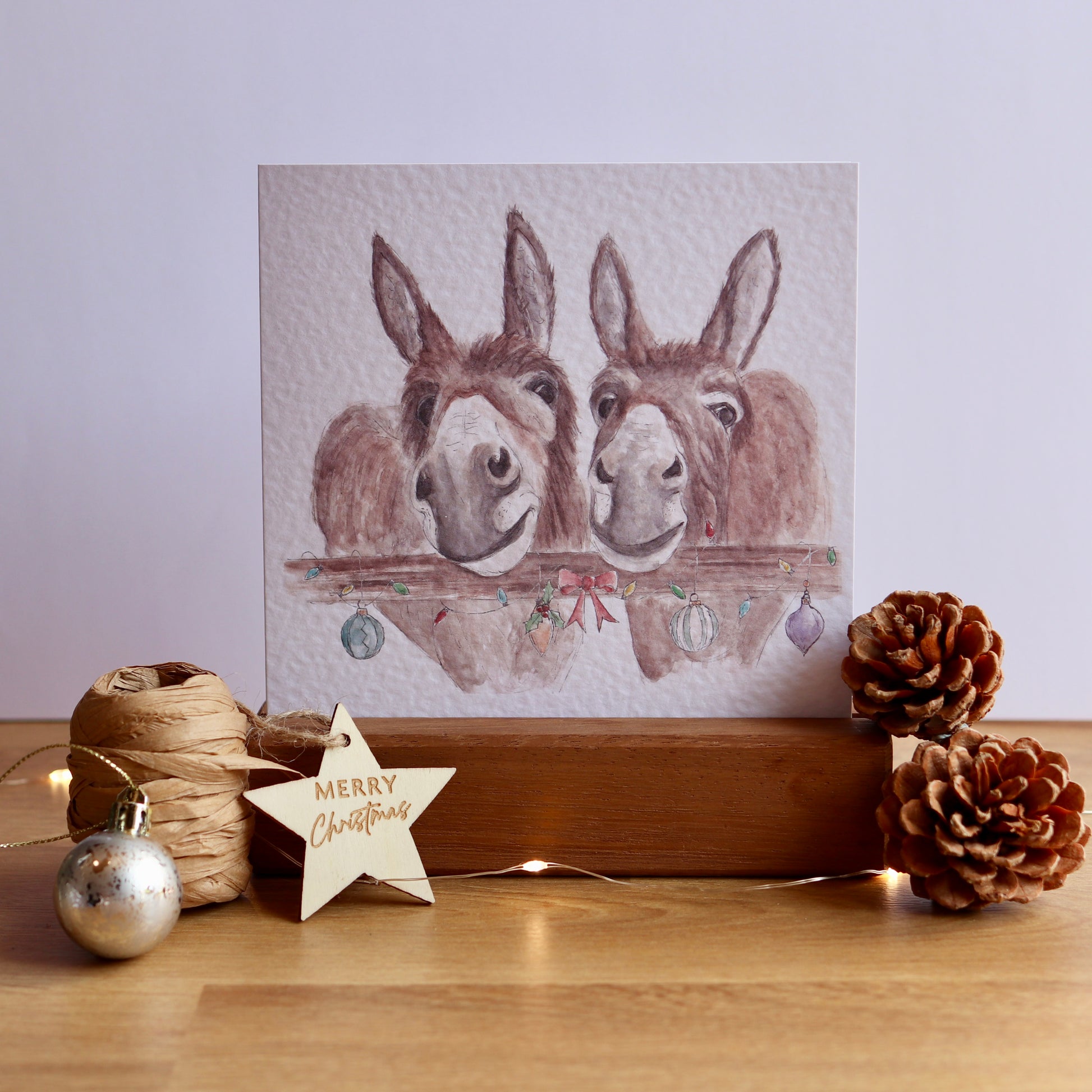 Christmas card with illustration of two donkeys