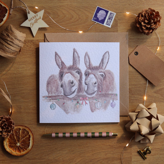 Christmas card of festive donkeys