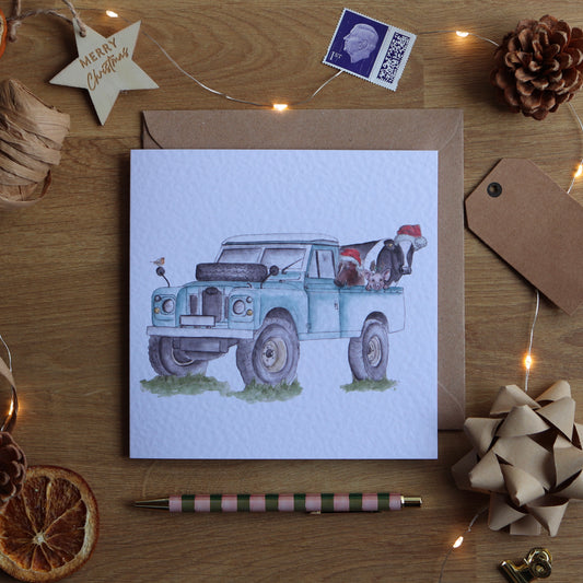 Christmas card with illustration of festive farm defender