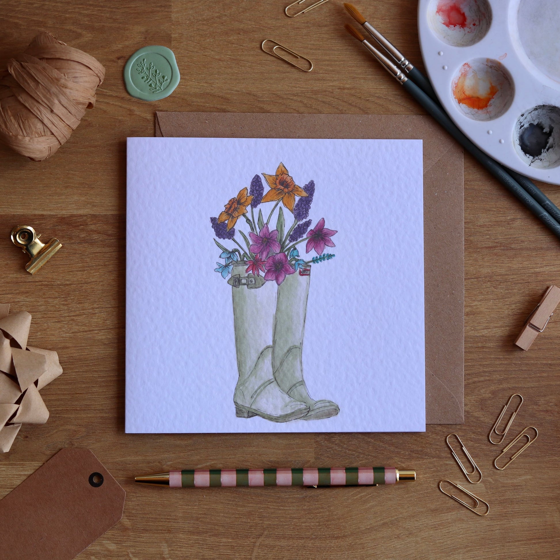 Greeting card with illustration of wellies full of flowers
