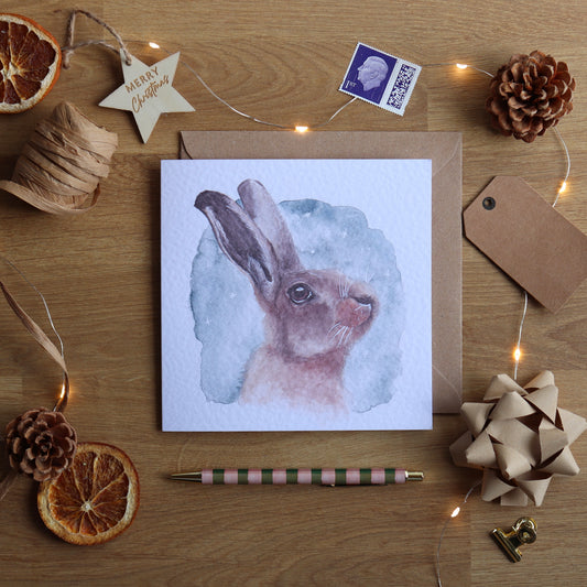 Christmas card with illustration of winter hare