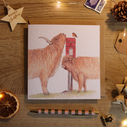 Greeting card with illustration of highland cows and postbox