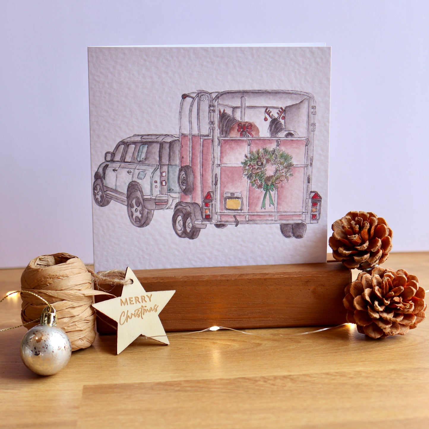 Christmas card with illustration of defender and horse box