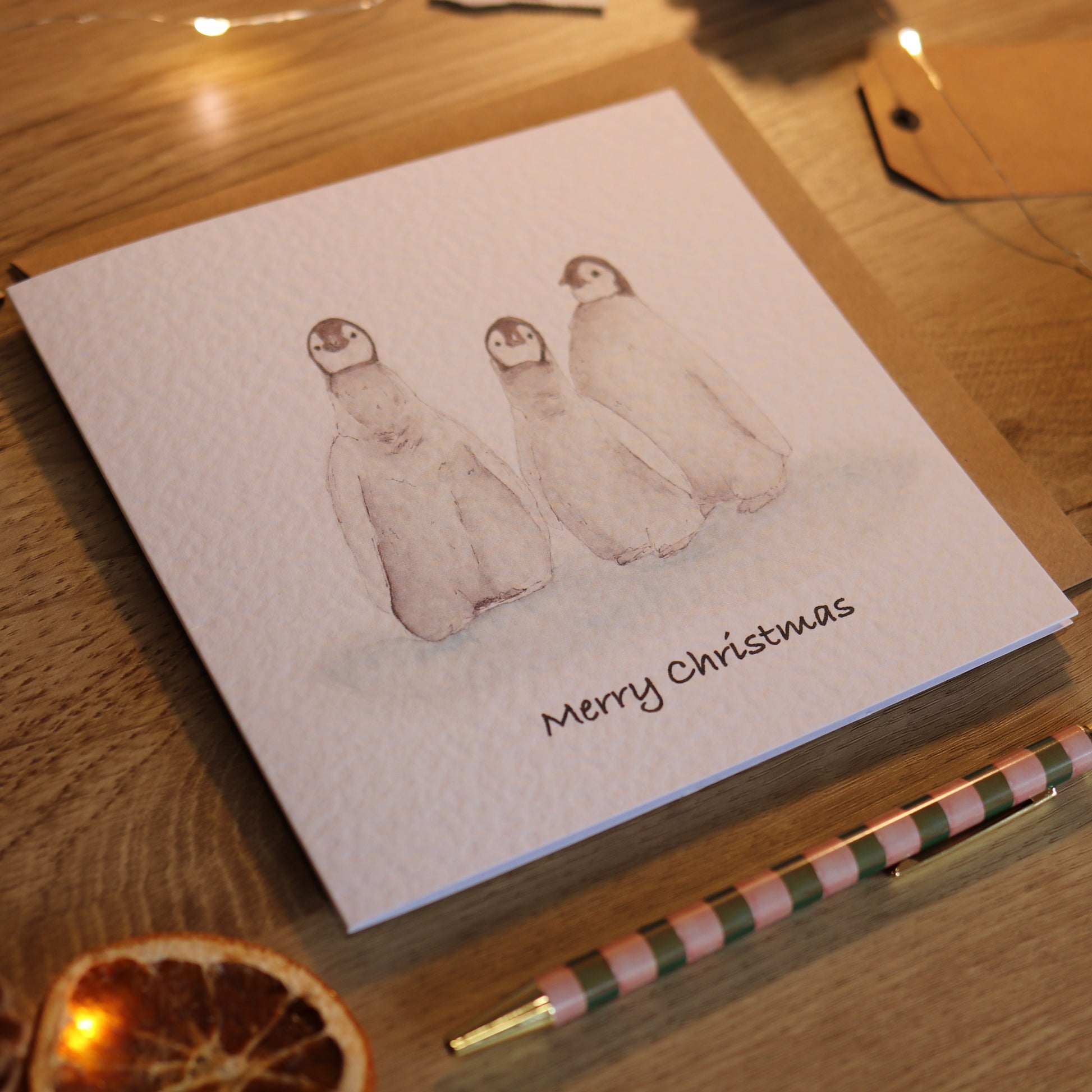 Christmas card with illustration of penguin babies