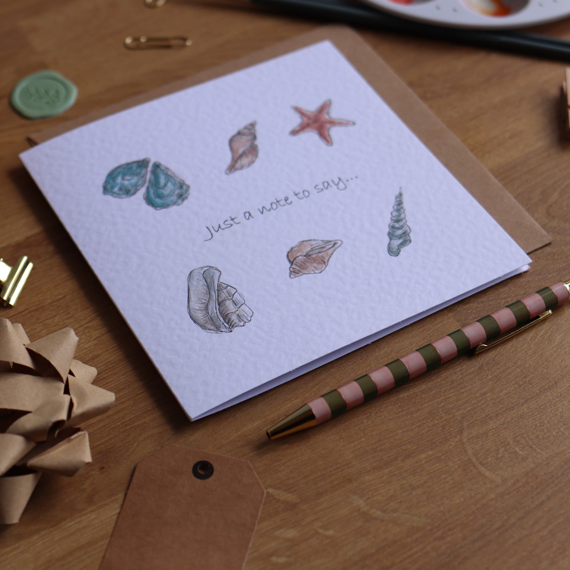 Greeting card with shells and wording just note to say